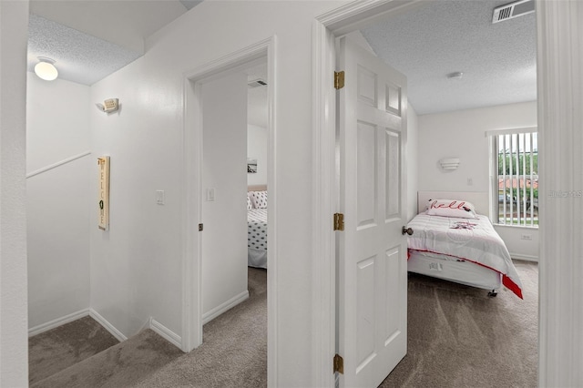 1029 Park Ridge Cir, Kissimmee, FL 34746 - hall featuring carpet flooring, a textured ceiling, and baseboards