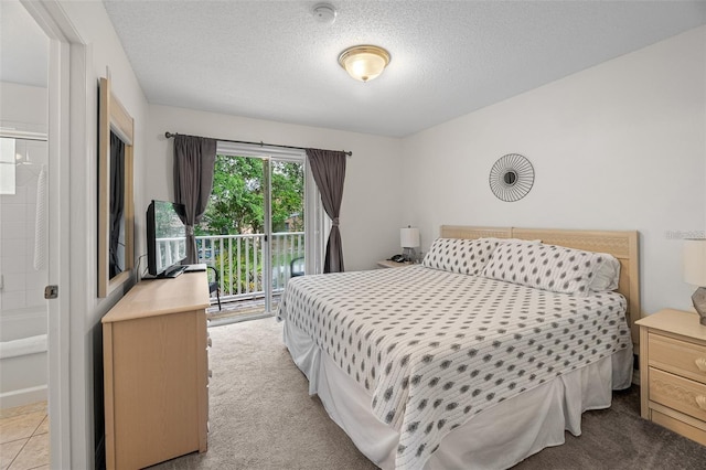 1029 Park Ridge Cir, Kissimmee, FL 34746 - bedroom featuring light carpet, a textured ceiling, and access to outside