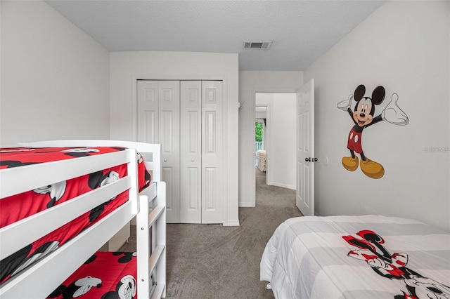 1029 Park Ridge Cir, Kissimmee, FL 34746 - bedroom featuring carpet flooring, a closet, a textured ceiling, and baseboards