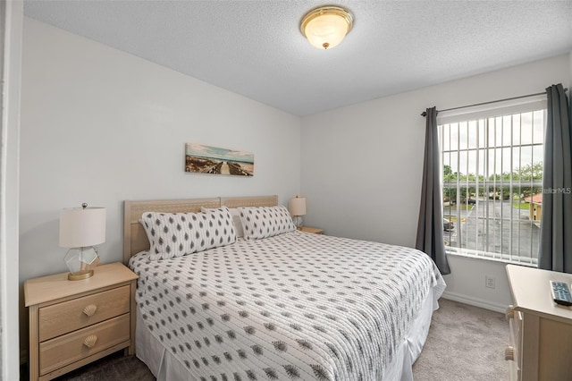 1029 Park Ridge Cir, Kissimmee, FL 34746 - carpeted bedroom featuring baseboards and a textured ceiling