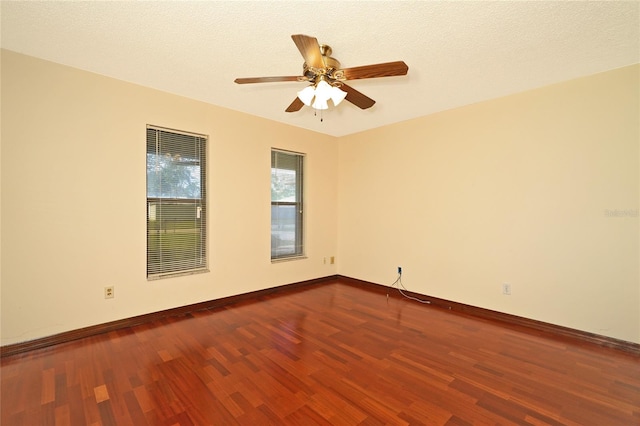 empty room featuring hardwood / wood-style floors, a textured ceiling, and ceiling fan