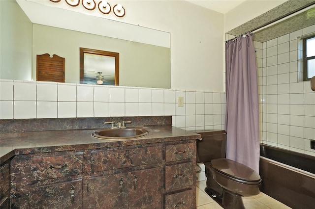 full bathroom with shower / bathtub combination with curtain, tile walls, toilet, vanity, and tile patterned flooring