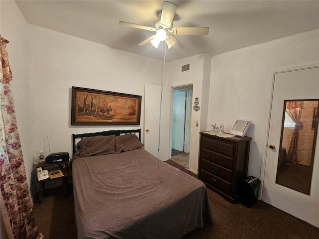 bedroom featuring ceiling fan and carpet