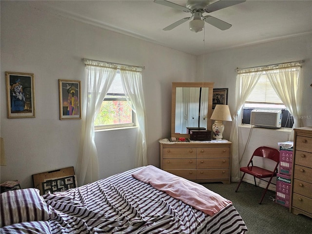 carpeted bedroom with cooling unit and ceiling fan