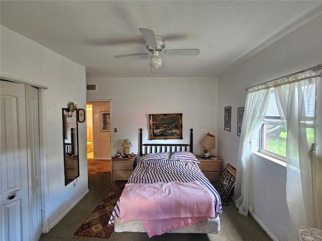 carpeted bedroom featuring a closet and ceiling fan