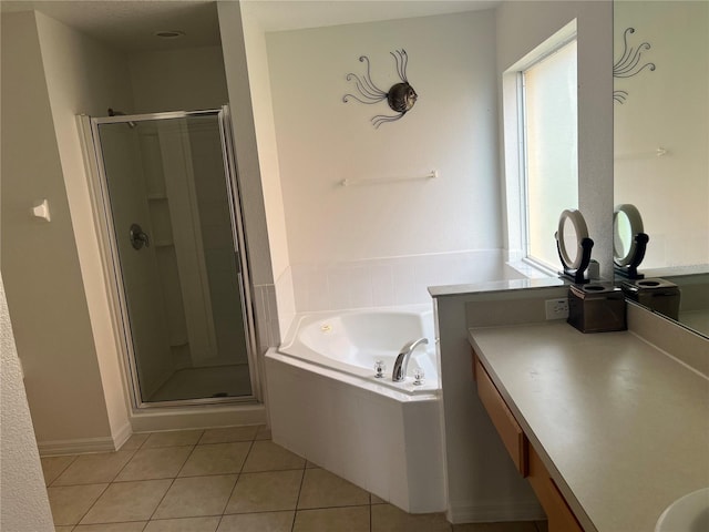 bathroom featuring vanity, plus walk in shower, and plenty of natural light