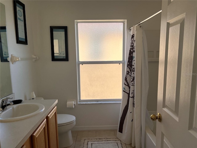 full bathroom featuring tile patterned floors, a wealth of natural light, vanity, and toilet