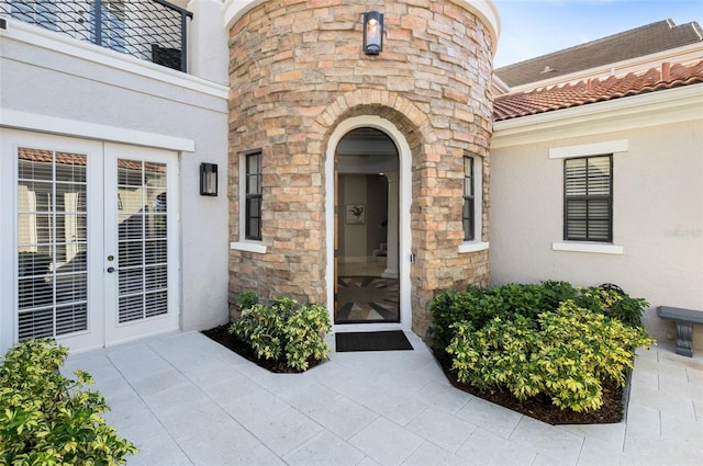 doorway to property with a patio and french doors