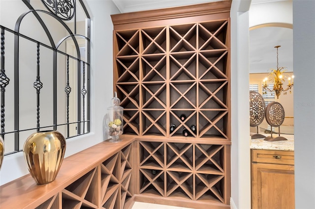 wine area featuring an inviting chandelier