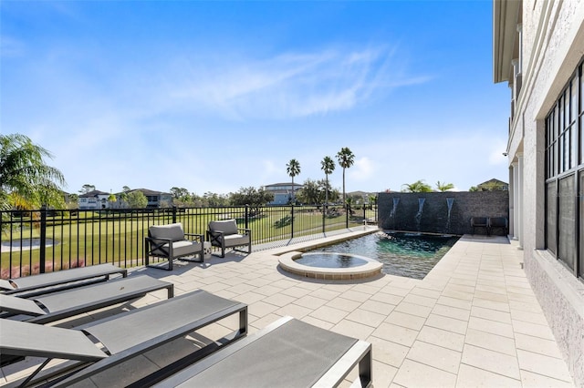 view of patio / terrace featuring a fenced in pool and pool water feature