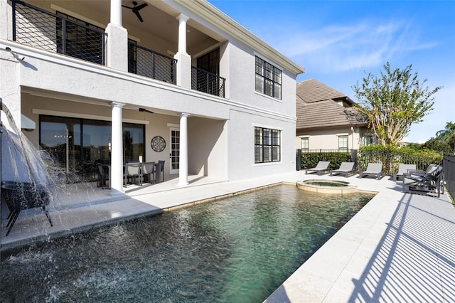 view of pool featuring an in ground hot tub and a patio area