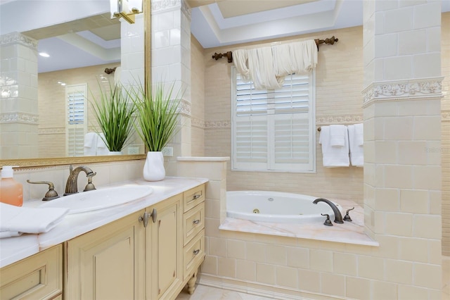 bathroom with vanity, a relaxing tiled tub, and tile walls