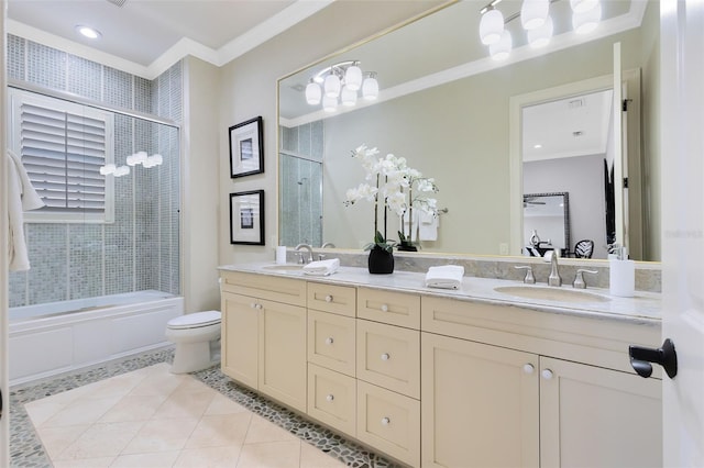 full bathroom with combined bath / shower with glass door, toilet, ornamental molding, vanity, and tile patterned floors