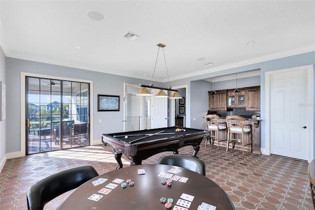 recreation room with crown molding and billiards