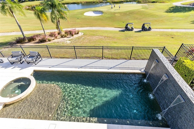 view of pool with a patio area, an in ground hot tub, and a water view