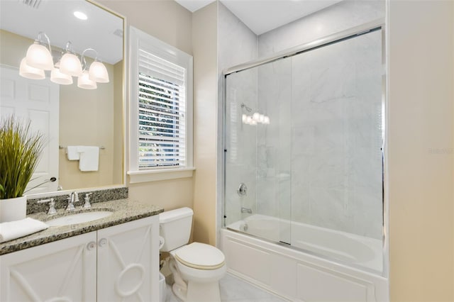 full bathroom with toilet, combined bath / shower with glass door, and vanity