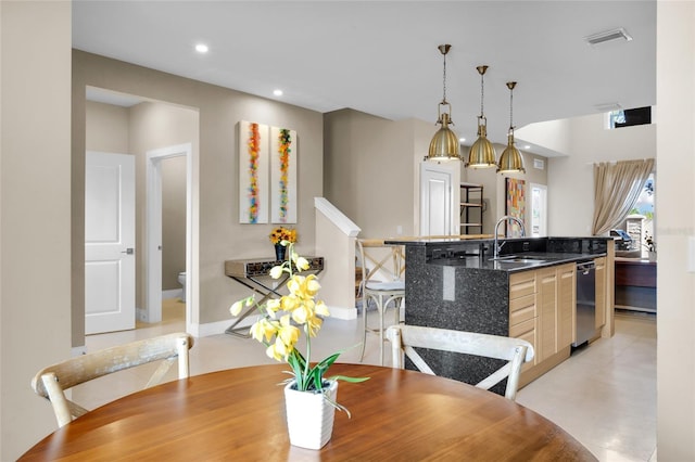 dining room featuring sink