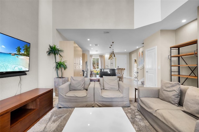 living room with a high ceiling