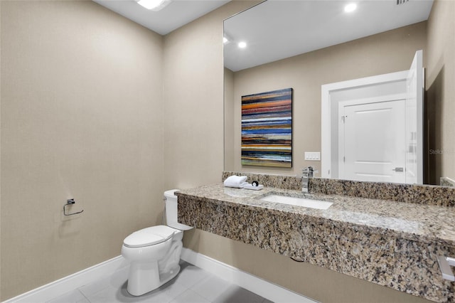 bathroom featuring tile patterned floors, sink, and toilet