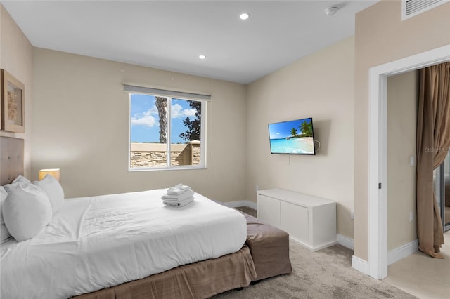 bedroom with light colored carpet