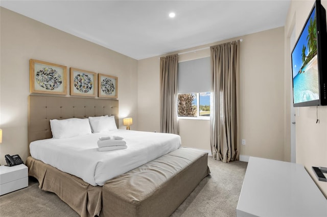 bedroom featuring light colored carpet