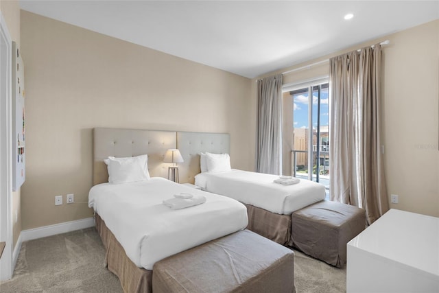 bedroom featuring access to outside and light colored carpet