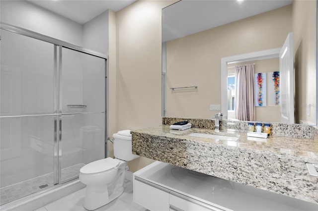 bathroom featuring vanity, toilet, walk in shower, and tile patterned flooring