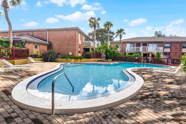 view of pool featuring a patio