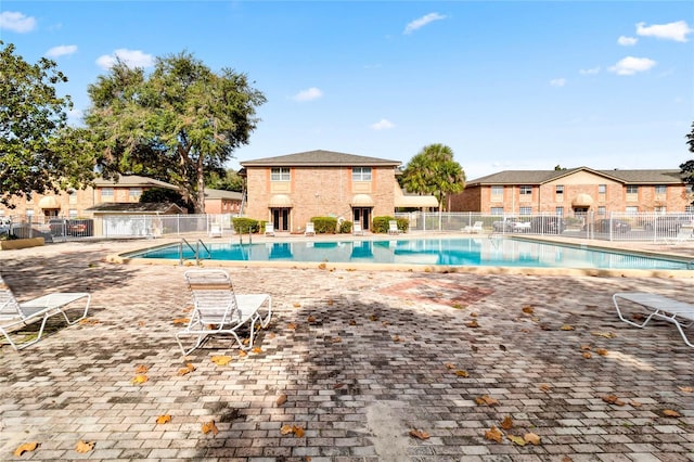 view of swimming pool with a patio area