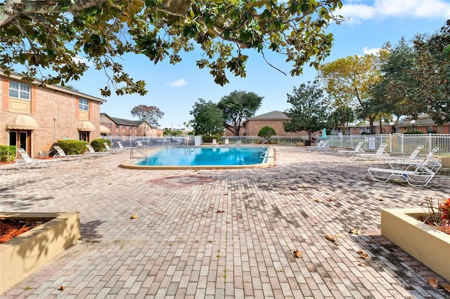 view of swimming pool with a patio