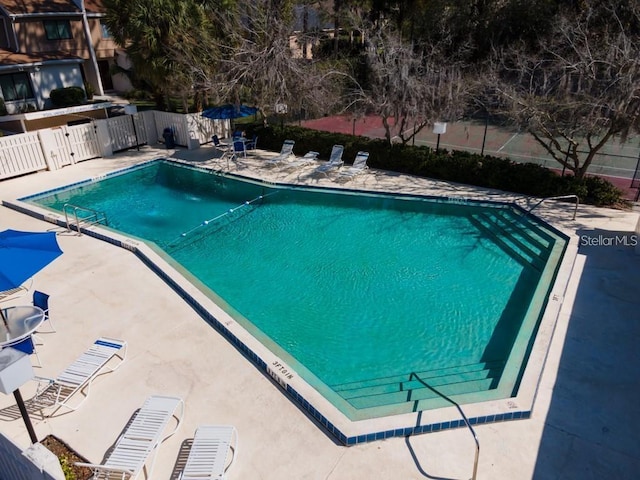 view of swimming pool with a patio area