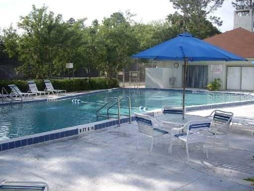 view of swimming pool with a patio