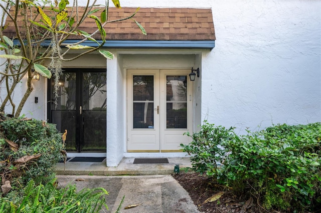 property entrance featuring french doors