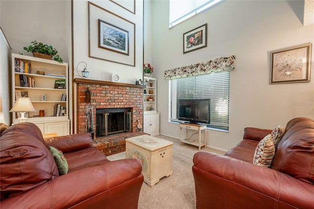 carpeted living room with built in features, a fireplace, and a high ceiling