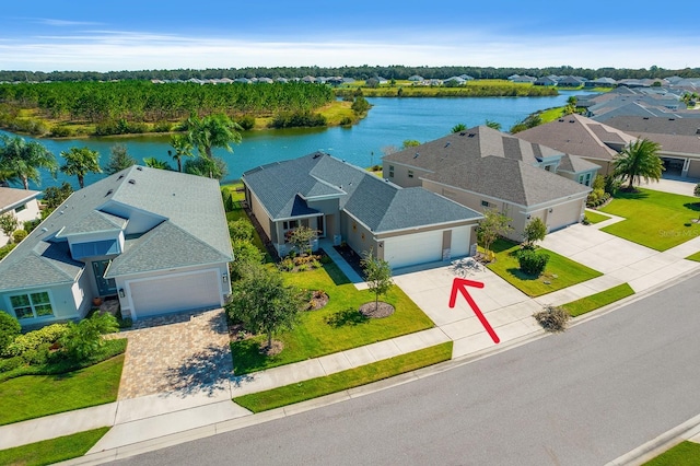 birds eye view of property with a water view