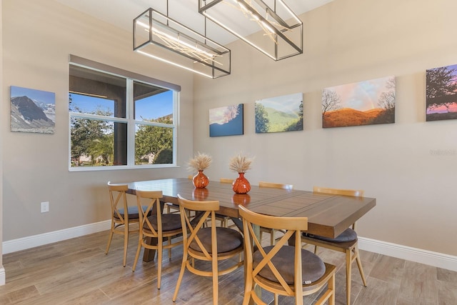 dining area featuring light wood-type flooring