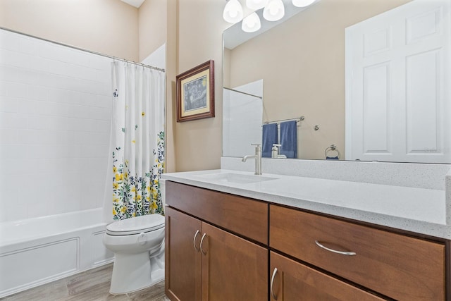 full bathroom featuring wood-type flooring, vanity, toilet, and shower / bath combination with curtain