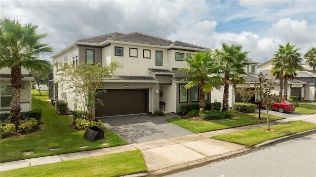 view of front facade with a front lawn and a garage