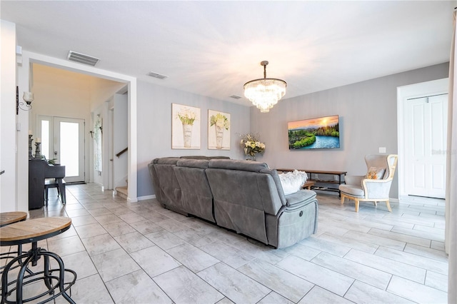 living room with an inviting chandelier