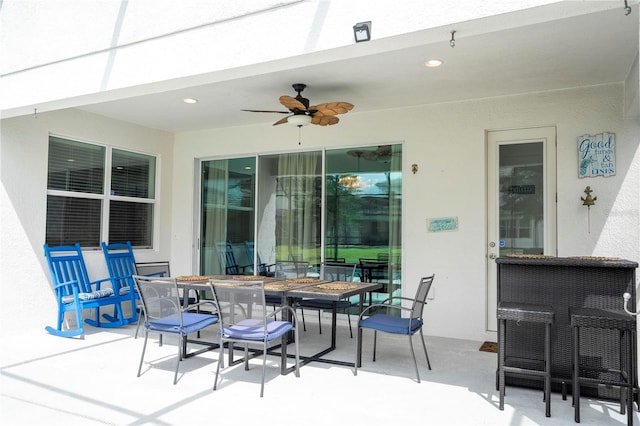 view of patio featuring ceiling fan