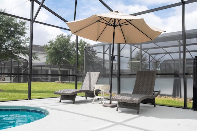 view of swimming pool featuring a patio area, a yard, and glass enclosure