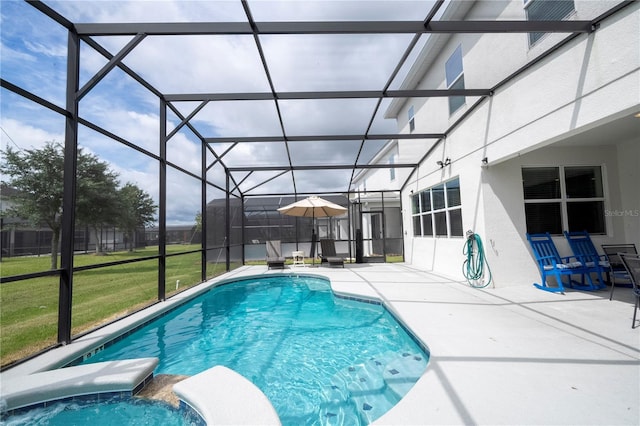 view of swimming pool with a lawn, a patio area, and glass enclosure