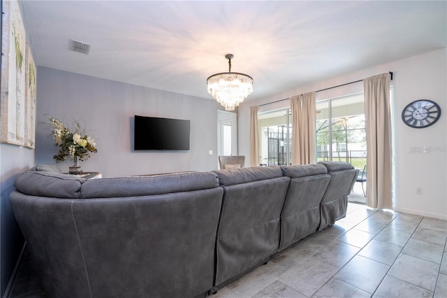 living room featuring a notable chandelier