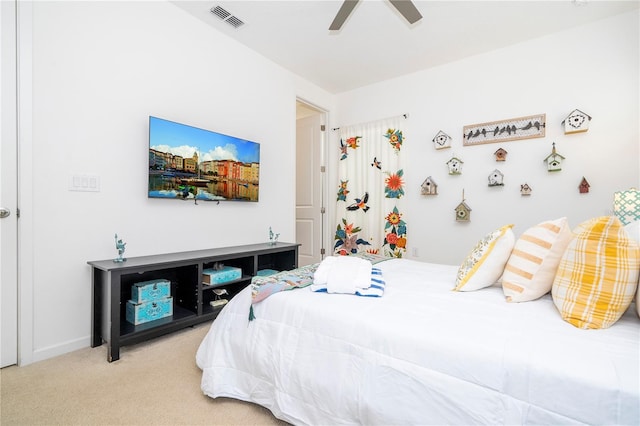 bedroom with ceiling fan and carpet floors