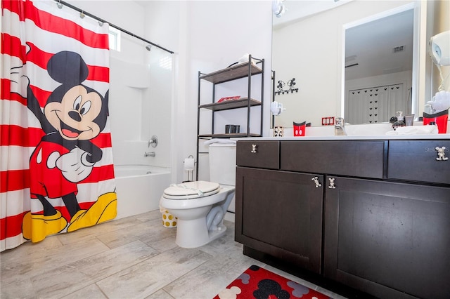 full bathroom featuring vanity, toilet, wood-type flooring, and shower / tub combo