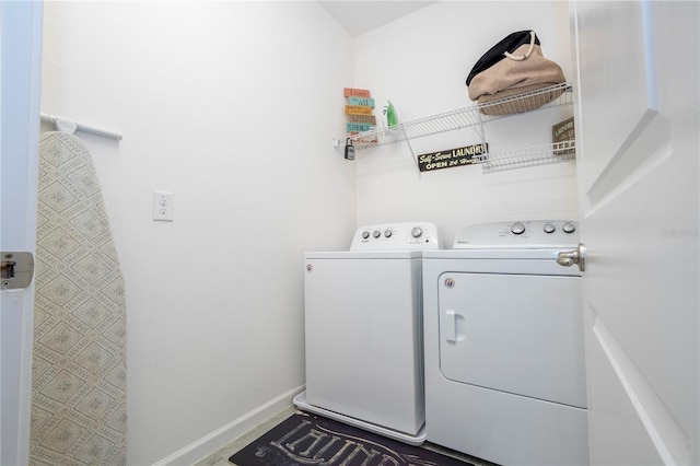 clothes washing area with washer and dryer