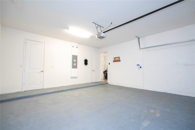 garage featuring a garage door opener and electric panel