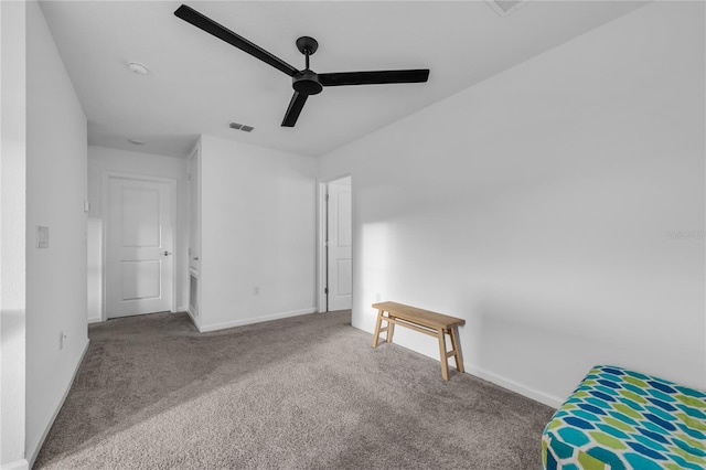 unfurnished bedroom featuring carpet and ceiling fan