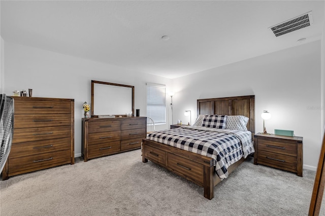 bedroom featuring light carpet