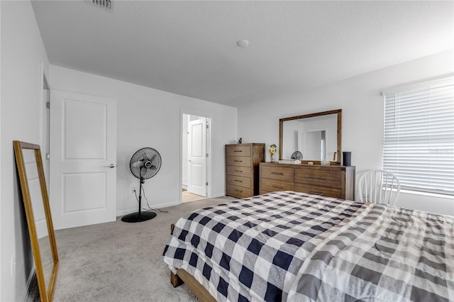 carpeted bedroom with a textured ceiling